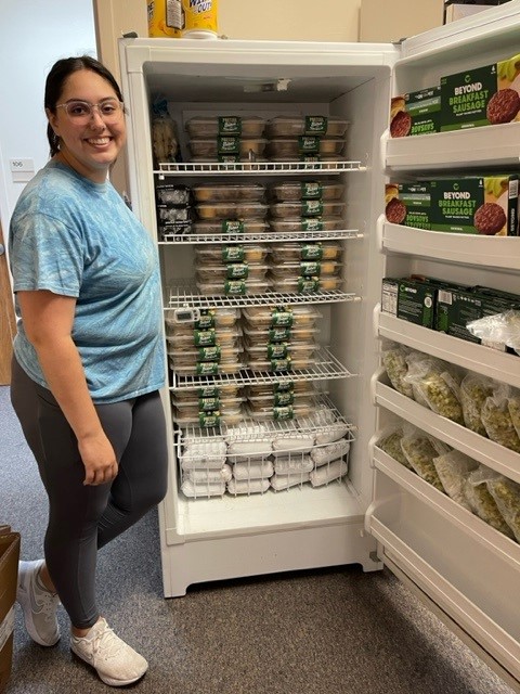 Student with freezer full of food.