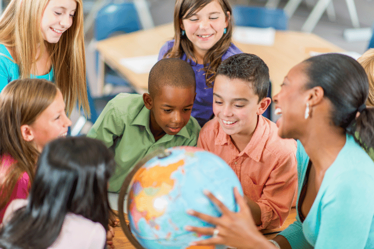 Elementary teacher with students.