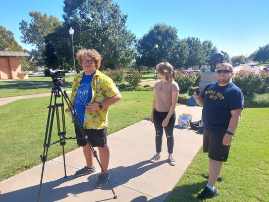 Students with camera equipment.
