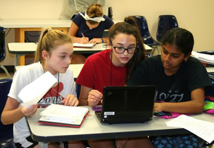 three girls and a laptop