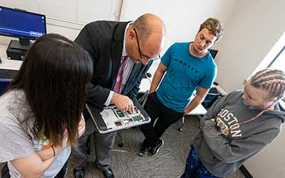 computer science professor with students